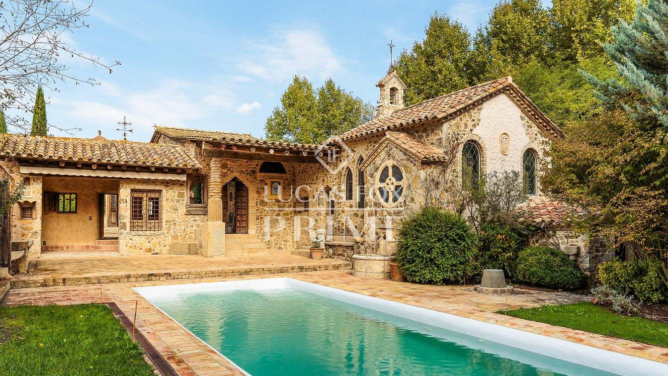 Swimming pool surrounded by gardens